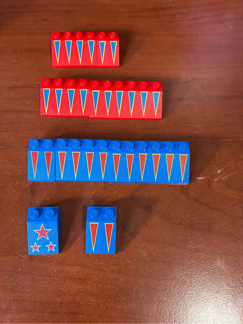 Lego Red and Blue Bricks with Yellow-Outlined Triangles and Star Decals